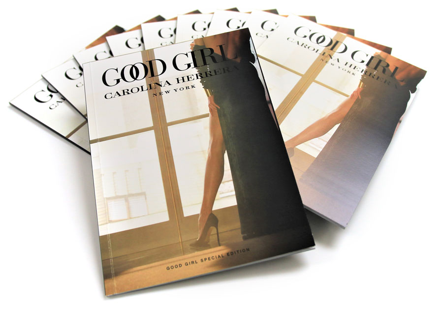 Booklets showcasing "Good Girl" by Carolina Herrera, featuring elegant design and high-quality printing, ideal for promotional material and marketing branding.