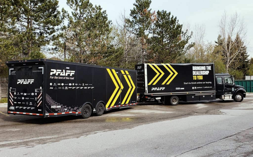 Commercial vehicle wrap featuring Pfaff branding, showcasing bold graphics and messaging, parked in an outdoor setting.